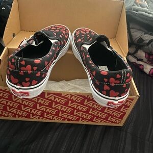 Brand new, never worn, women’s 7.5 classic slip on Hearts Vans
